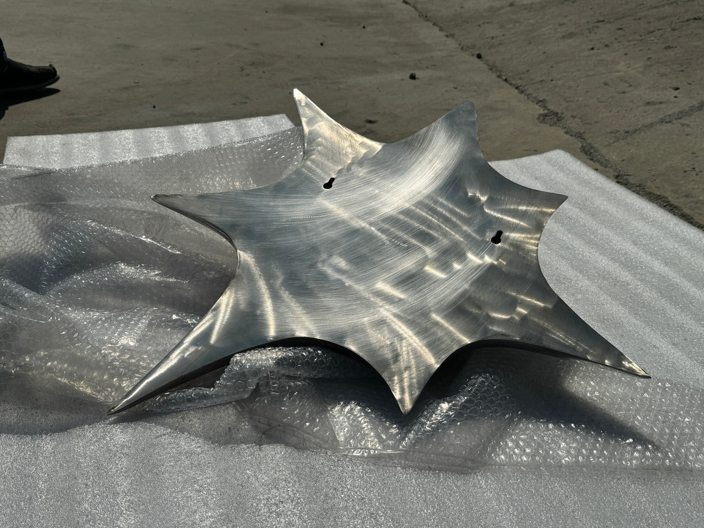 Snap! Stainless steel sculpture